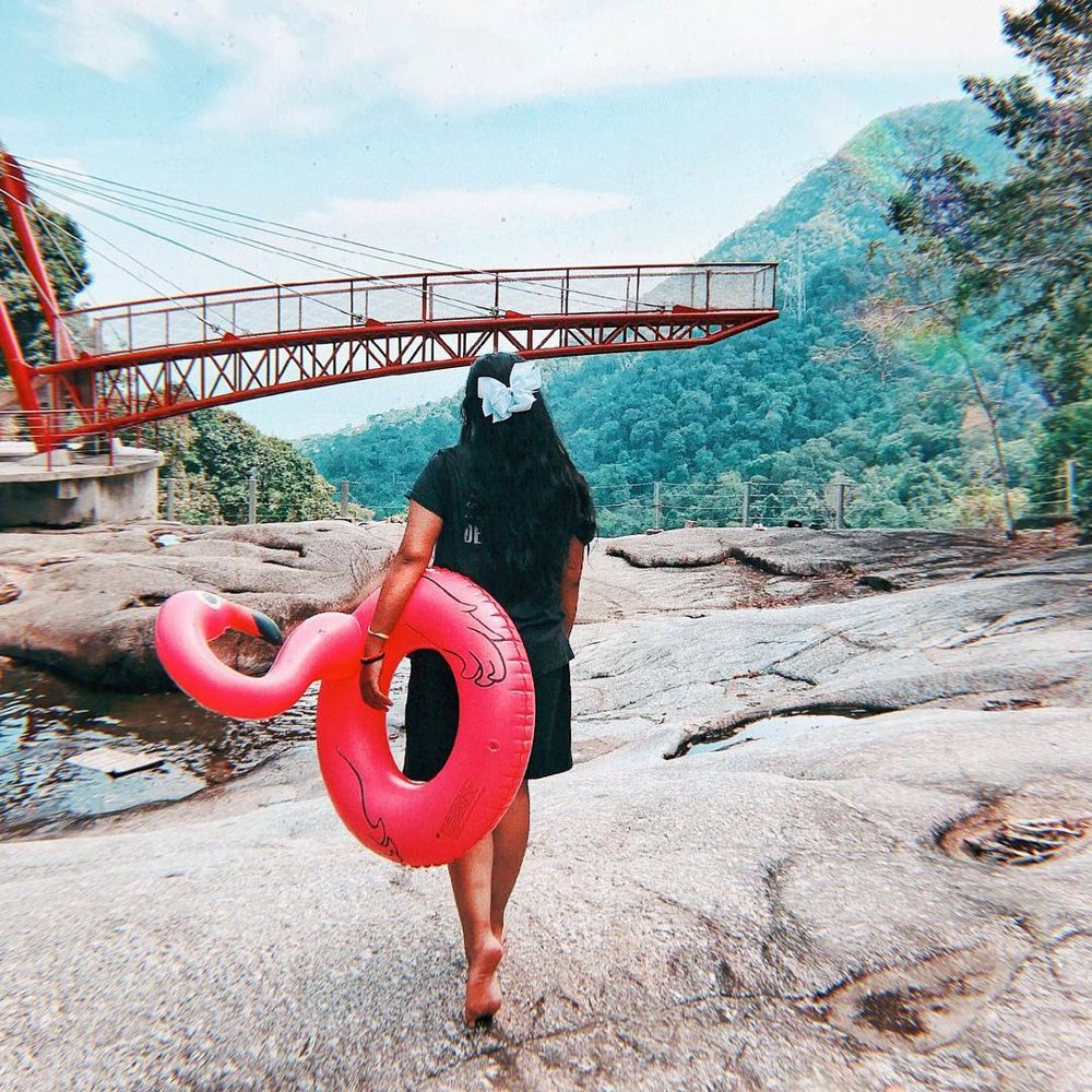 girl with float seven wells waterfall kedah