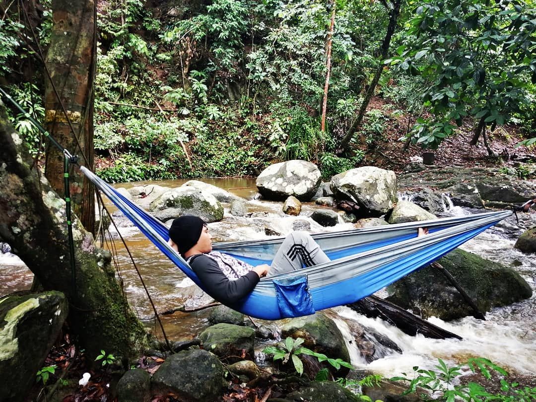 guy on hammock lata bukit hijau