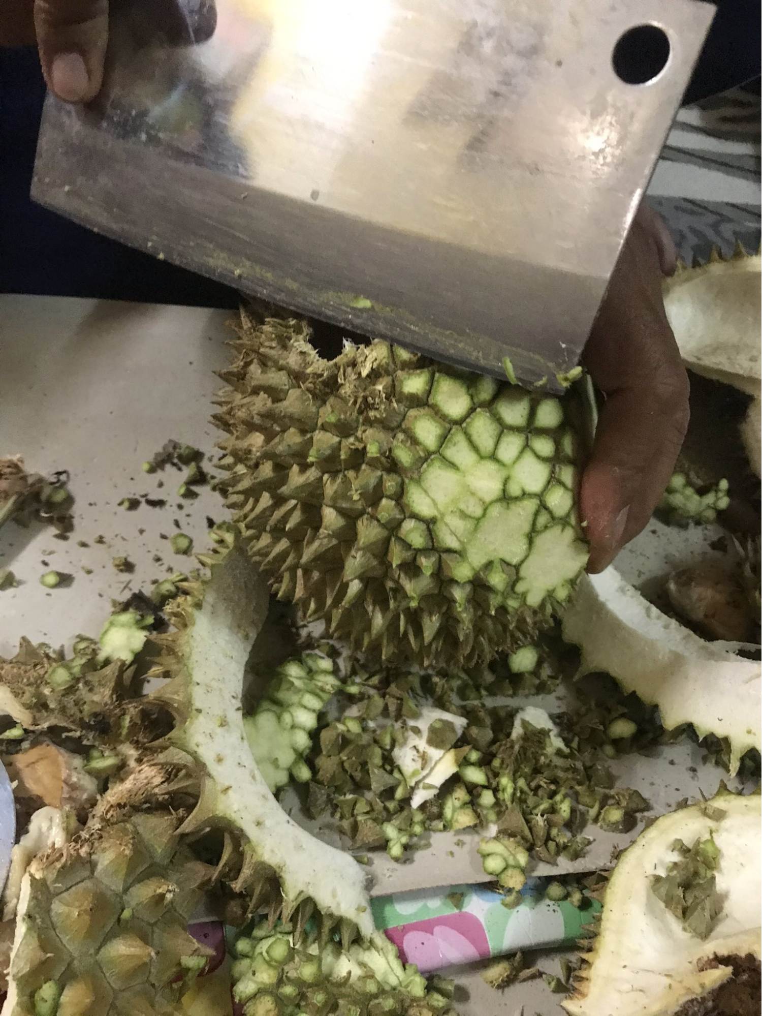 Malaysian man shaves durian