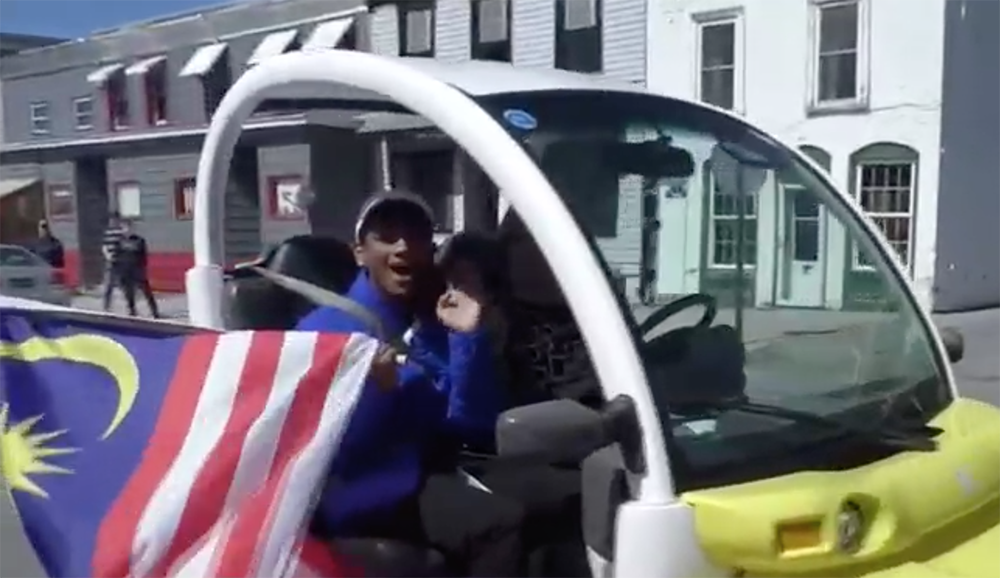 Murugan waving from car