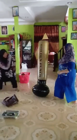 grandmothers play with punching bag (1)