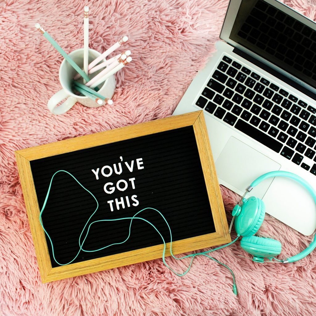 flatlay of pencils blackboard and laptop