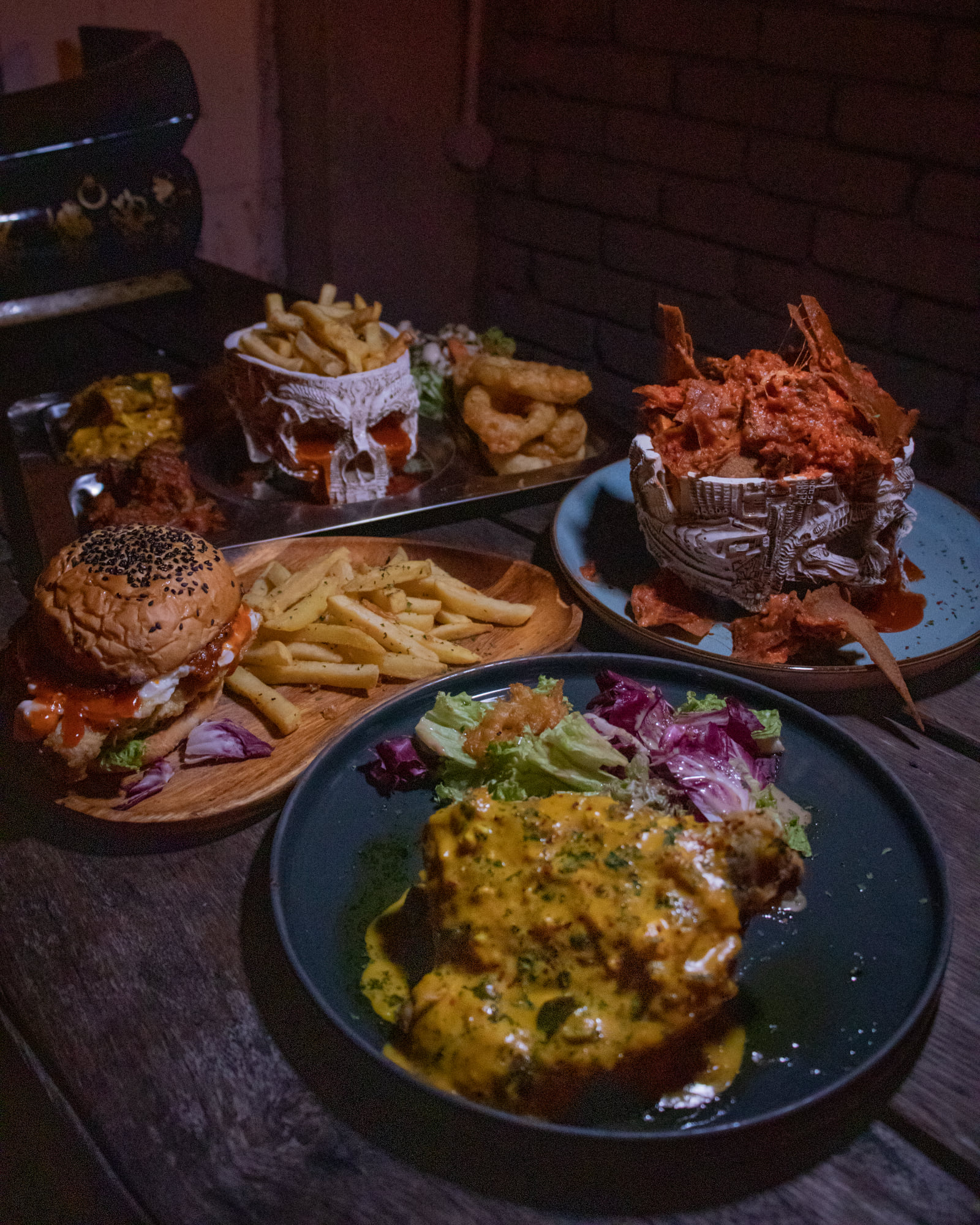 chicken chop, burger, fries, and nachos