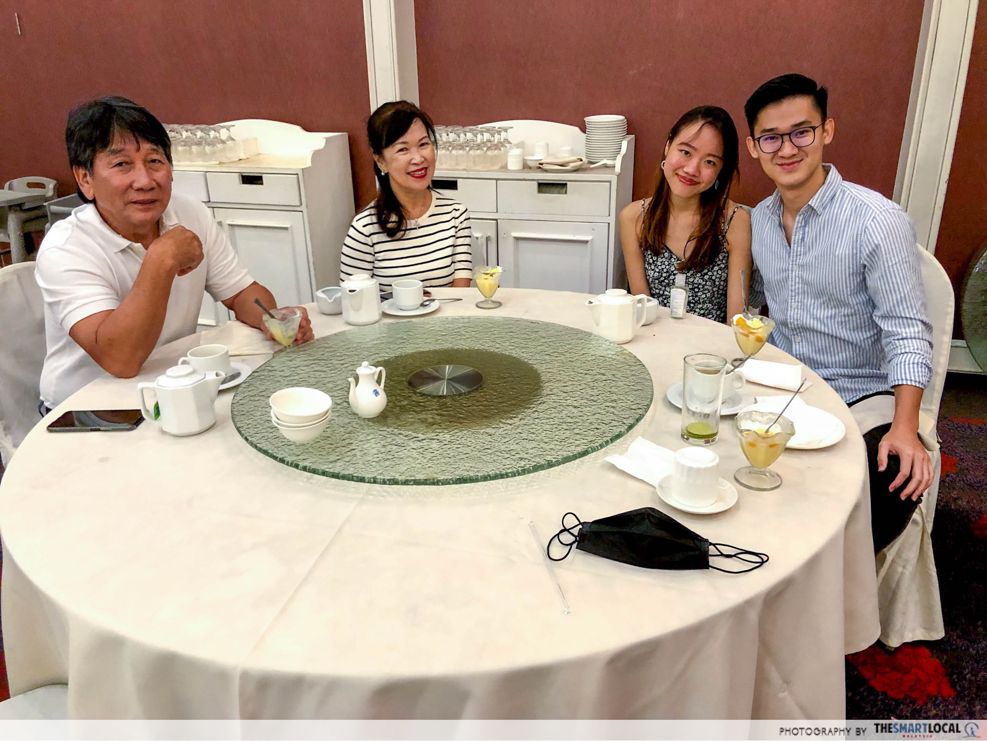 the author with her Airbnb hosts in Kuching