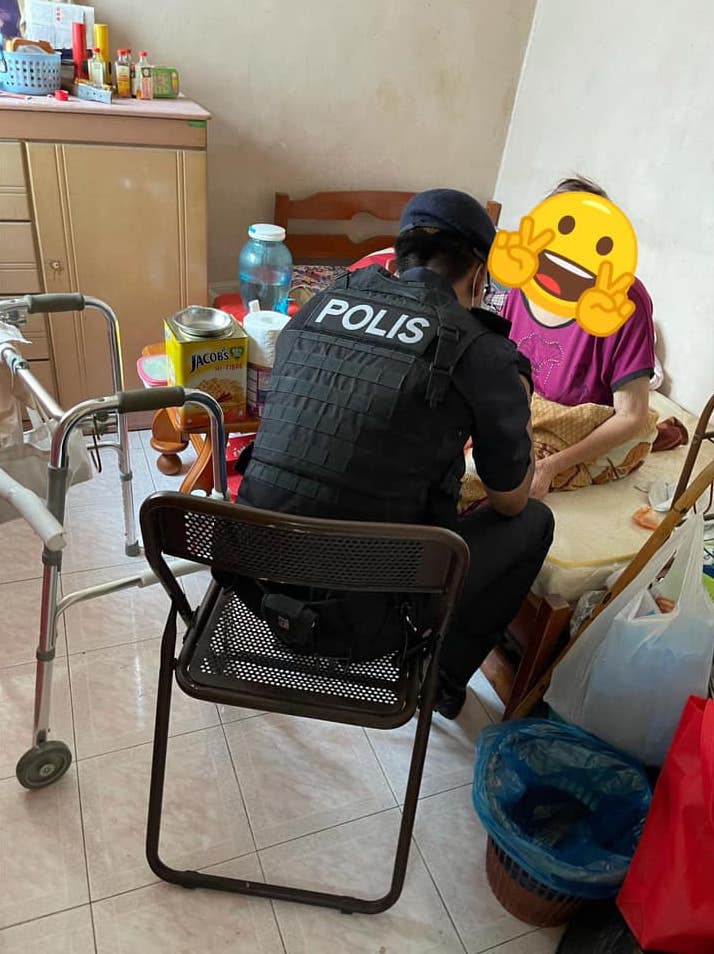 Policeman consoles elderly auntie 