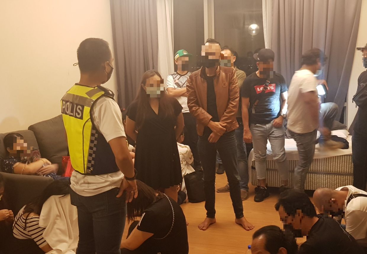 Police arrest people at a birthday party in KL