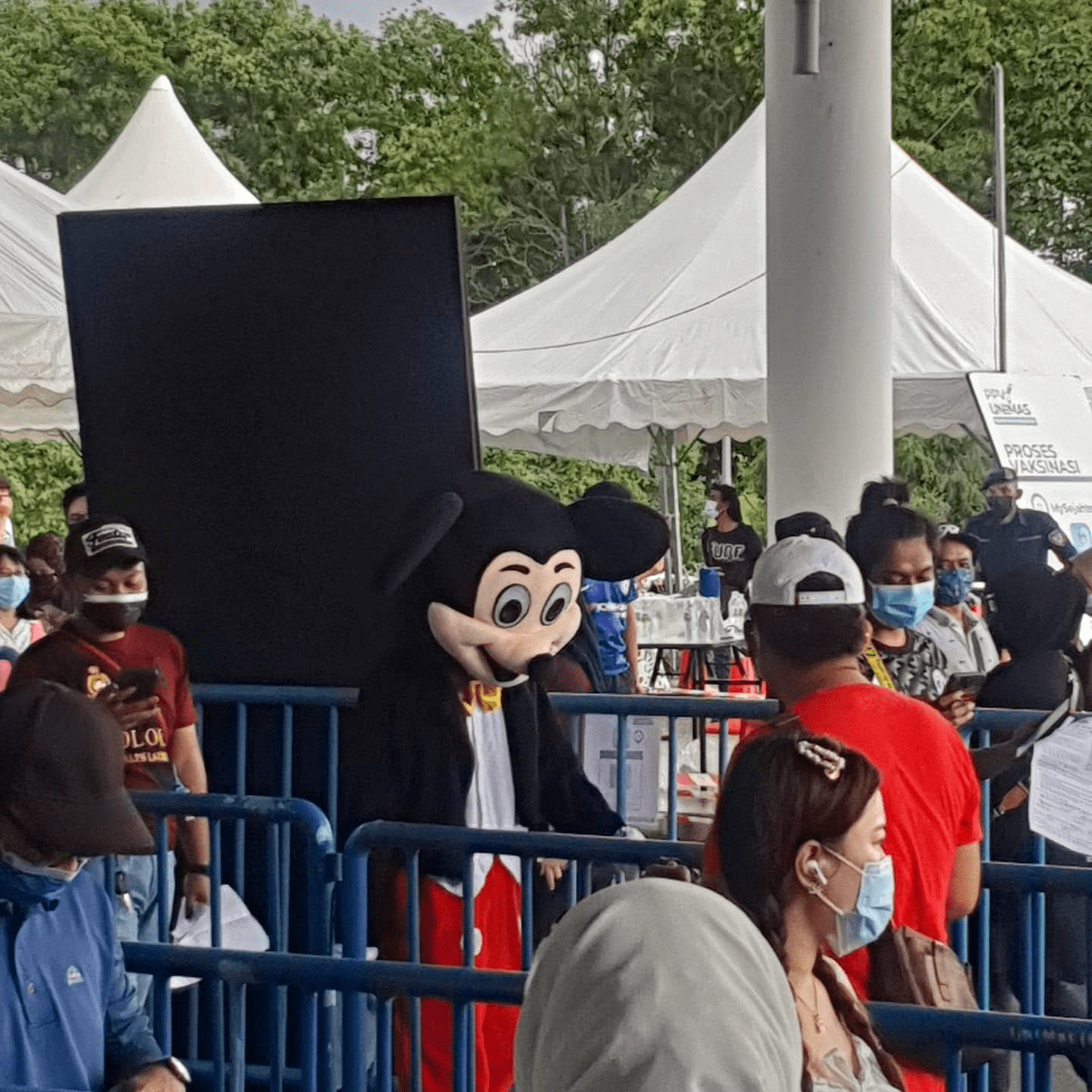 Malaysians wear costumes to vaccination - Mickey Mouse