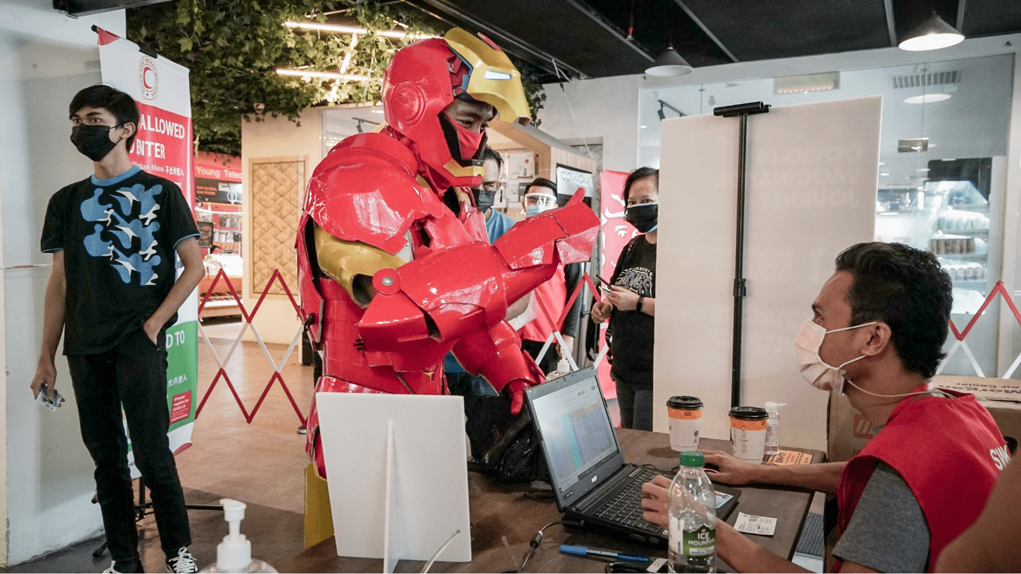 Malaysians wear costumes to vaccination - Iron Man