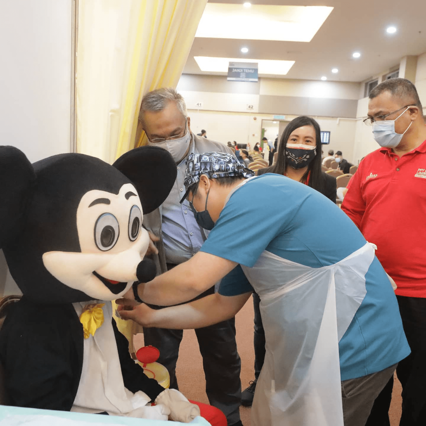 Malaysians wear costumes to vaccination - Mickey Mouse