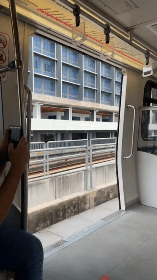 LRT train doors open during operation