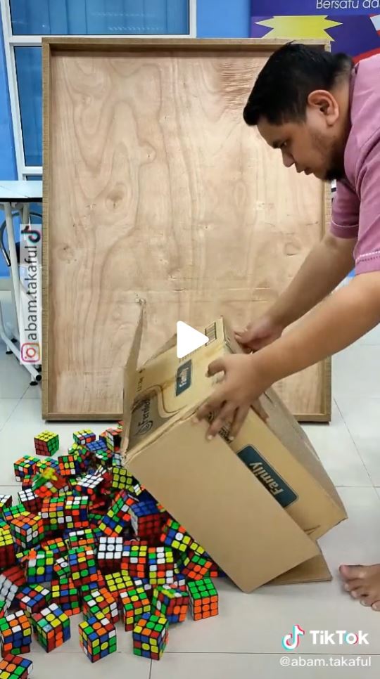 Man creating Rubik's Cube portrait