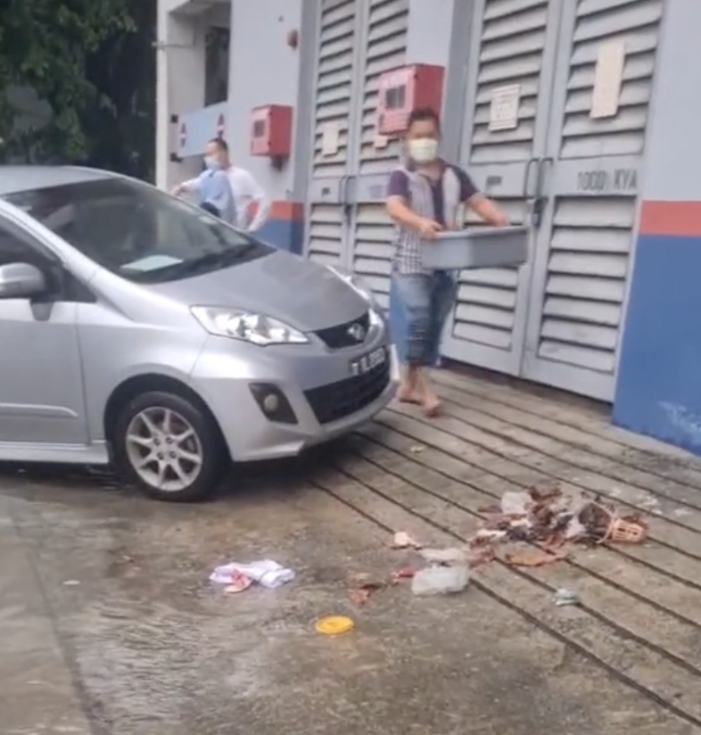 Man collects trash in flood - litter