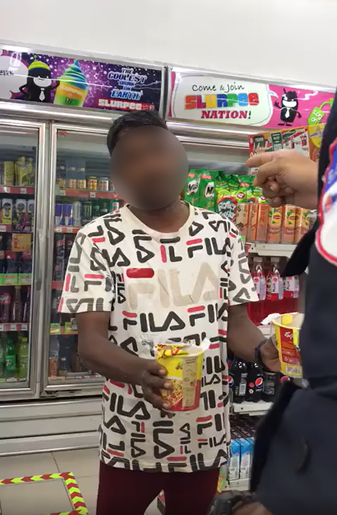 Man taking instant noodles from 7-Eleven