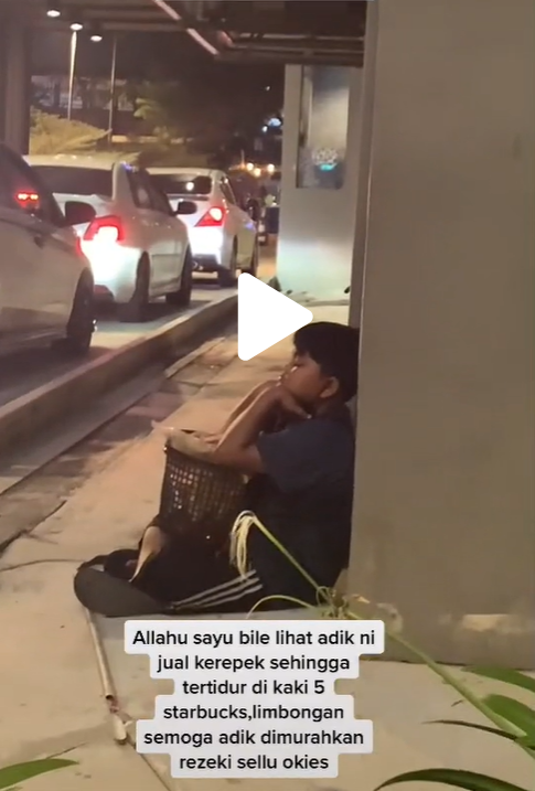 Boy sells snacks outside Starbucks