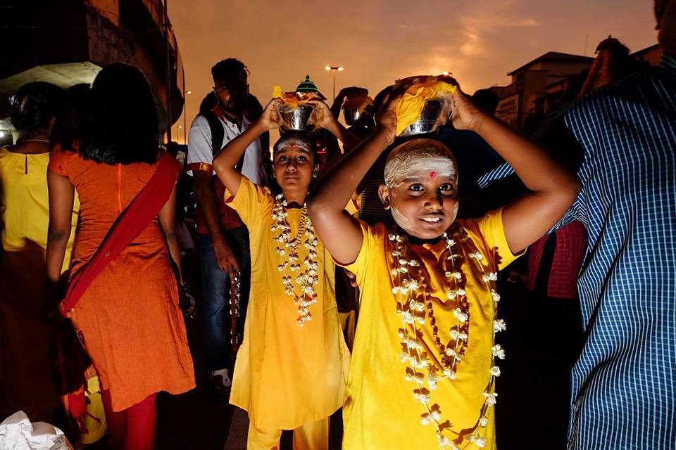 things to know about thaipusam - devotee carrying palkuddam