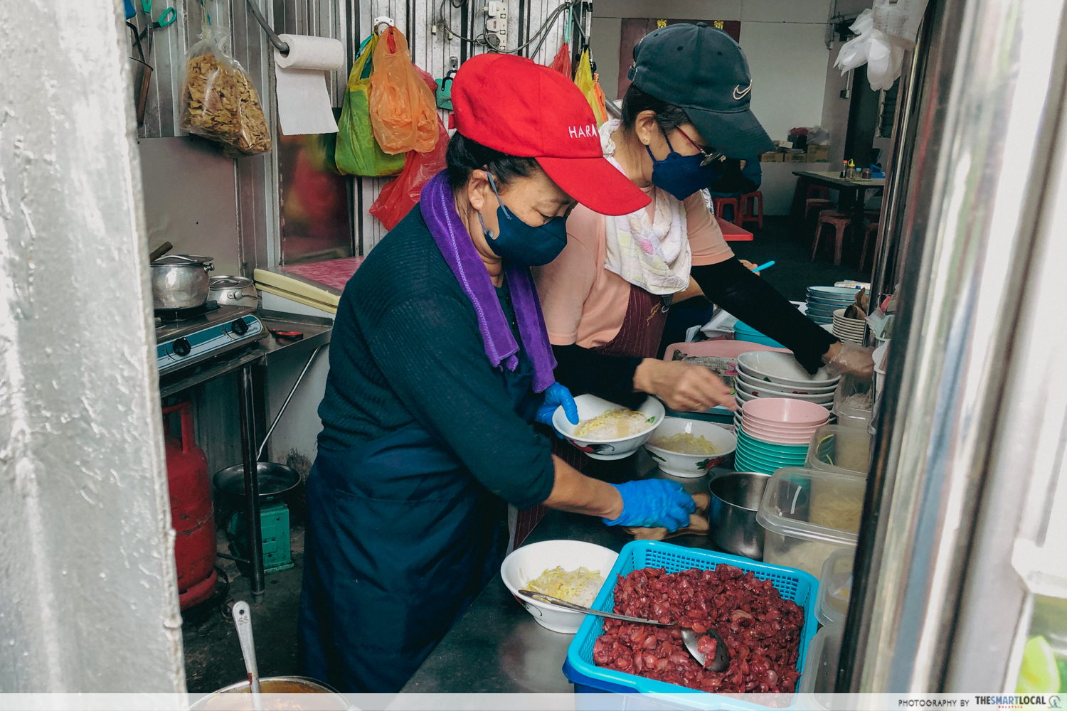 Siham Curry Mee - owner making curry