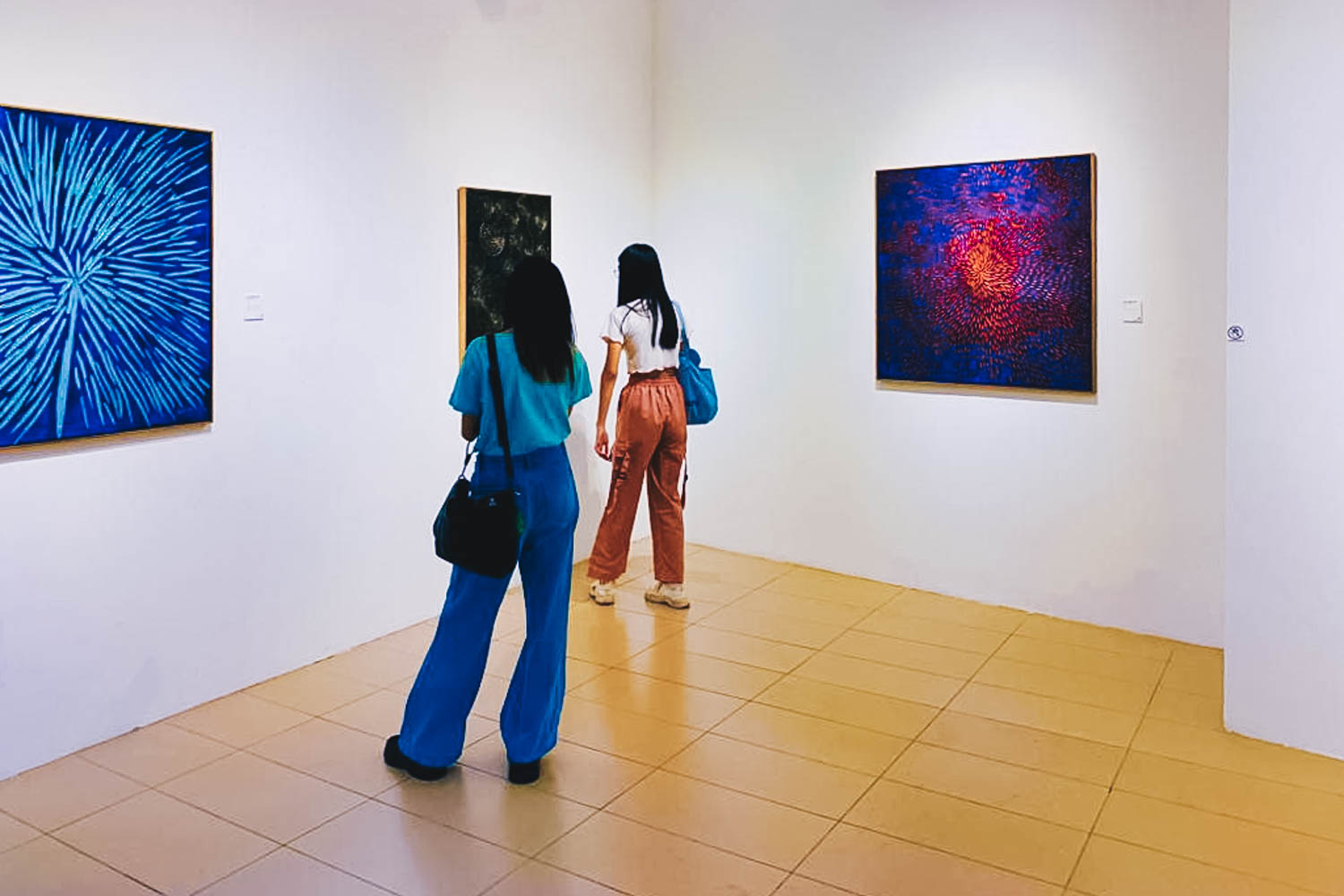 Telur Pecah Art Exhibition - visitors looking at the art