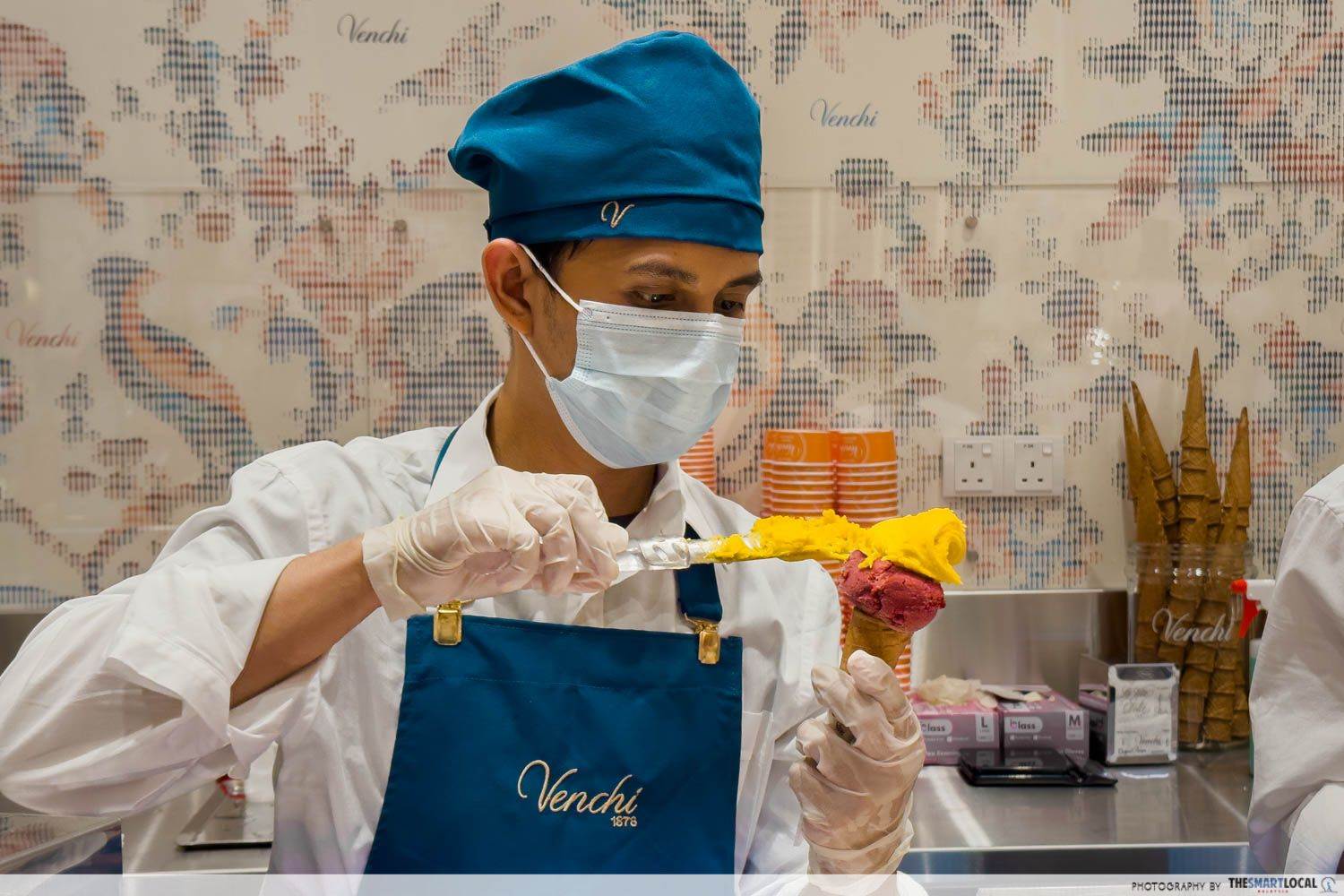 Staff serving gelato for customers