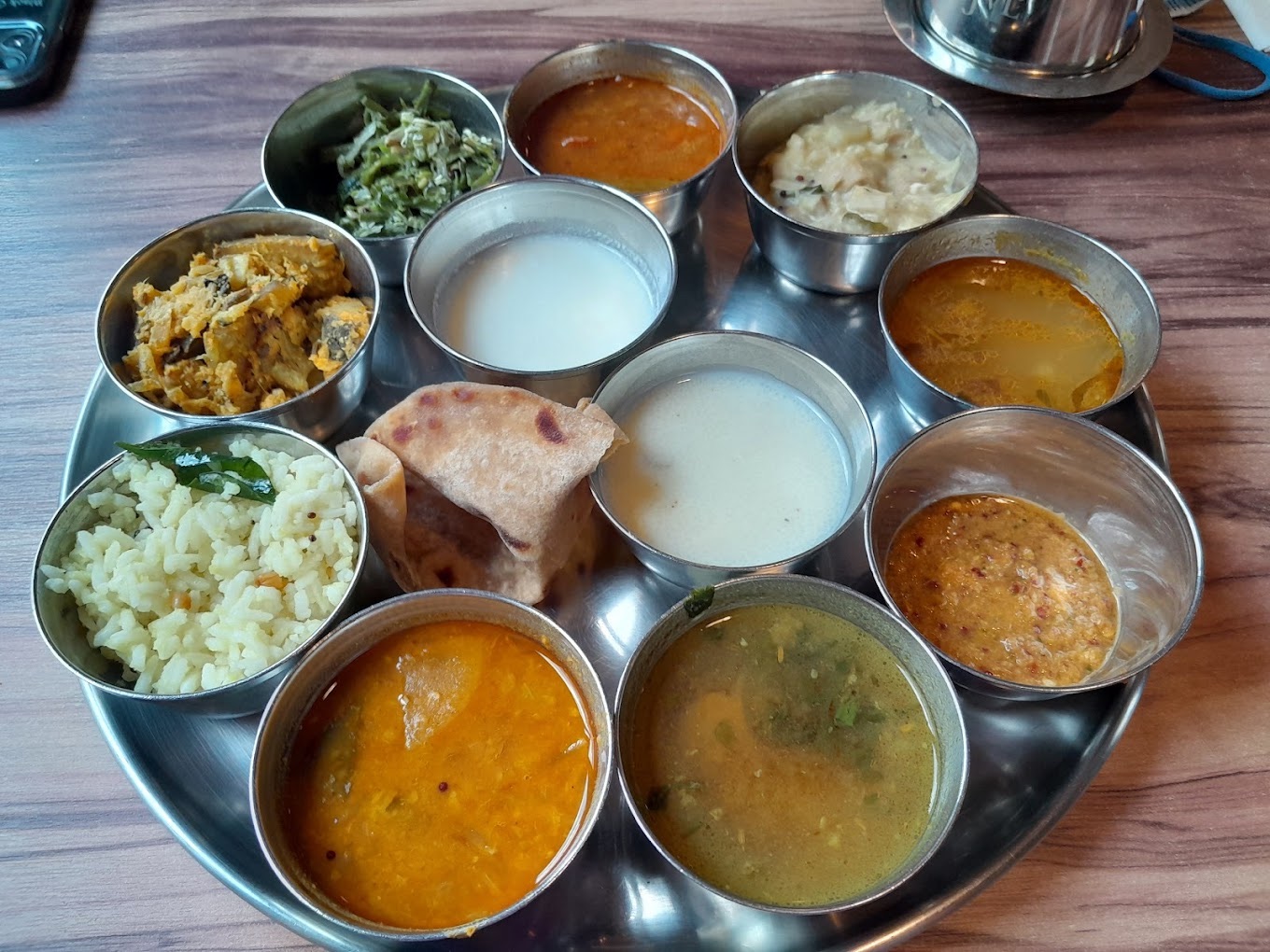 thali vegetarian set meal with ten small dishes and rice