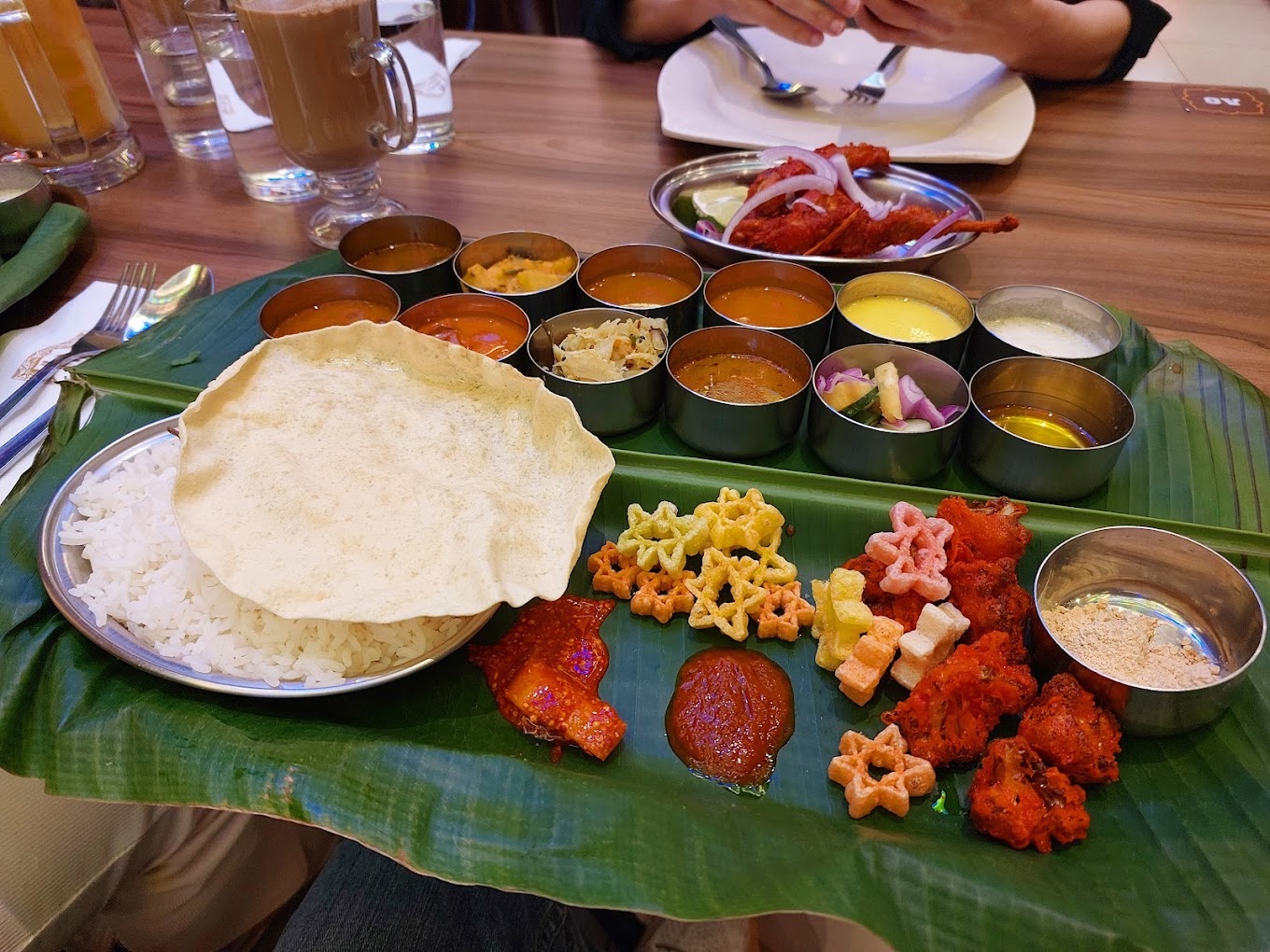 Indian restaurants in KL & PJ - banana leaf rice set with 20 dishes, rice, and papadum