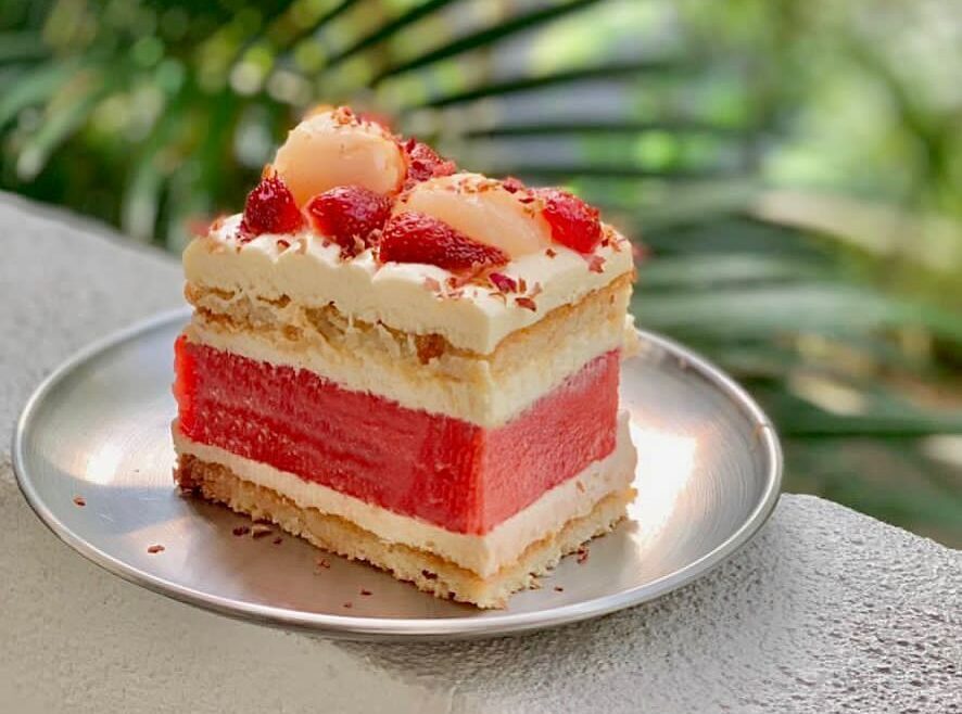 summer watermelon cake, featuring fresh watermelon slices sandwiched between layers of cream