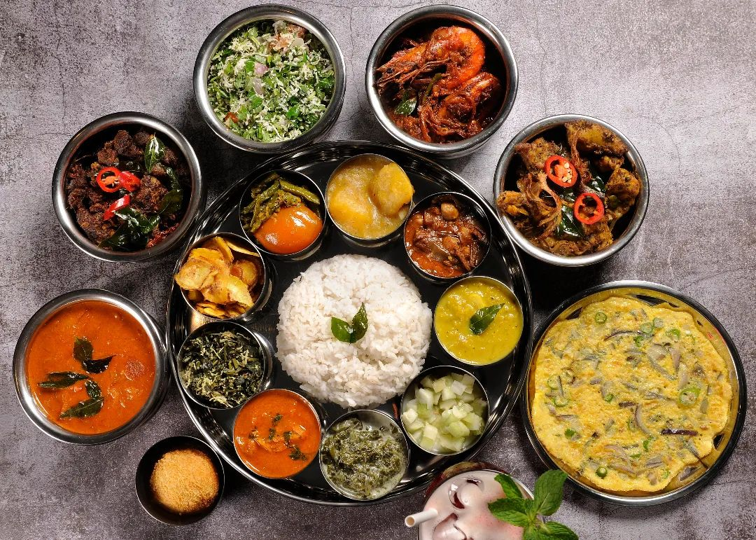 a dinner set with eight Sri Lankan dishes