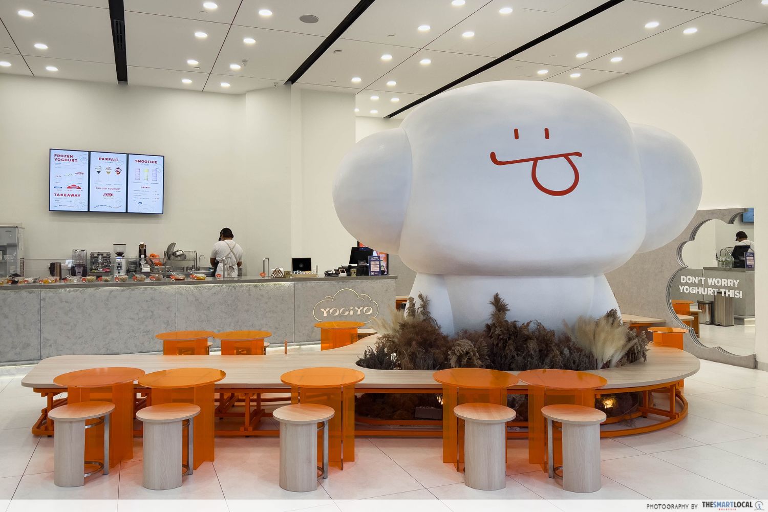 yogiyo interior with a blob-like white mascot, its tongue is sticking out mischievously