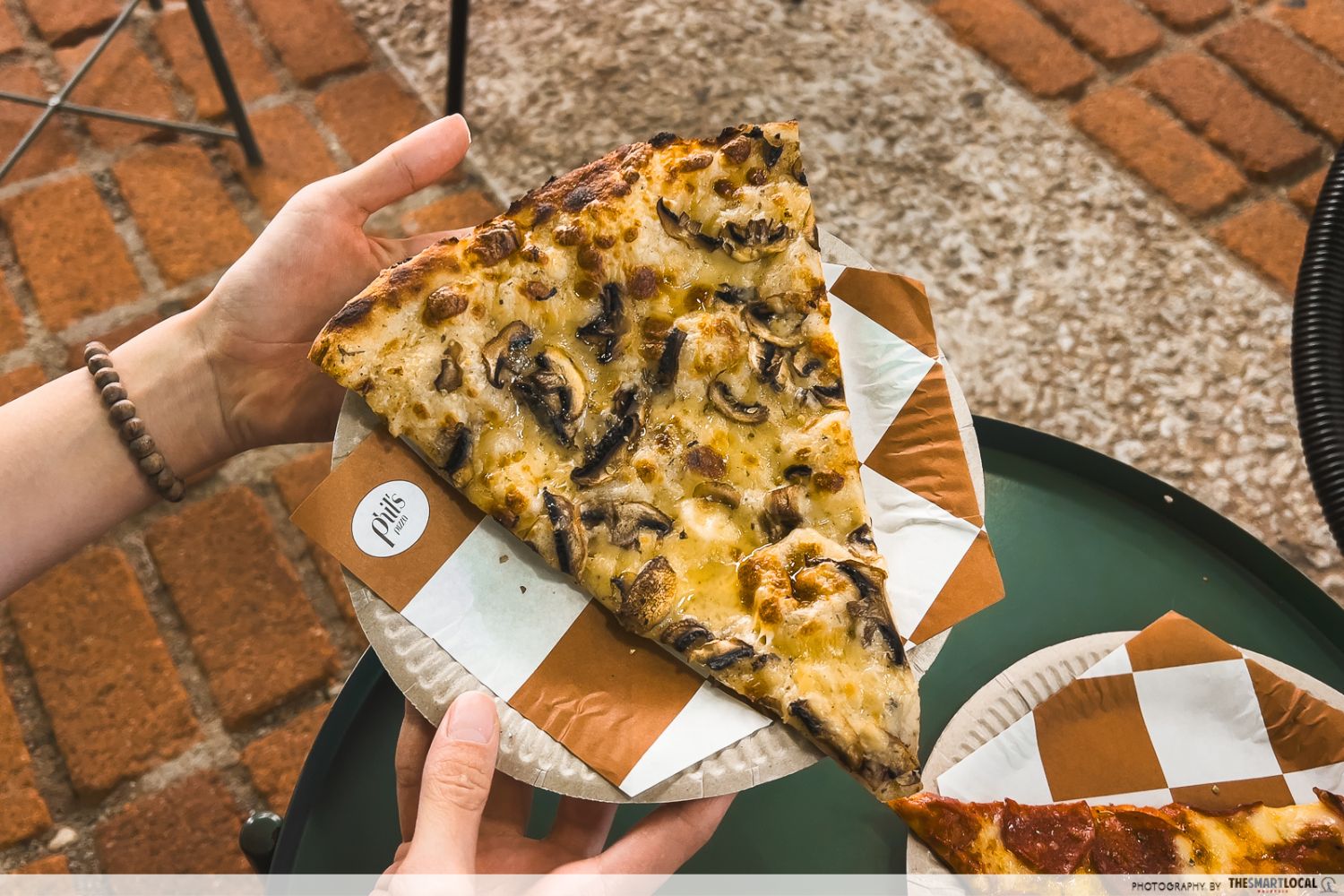 truffle pizza, which is vegan-friendly, topped with mushrooms