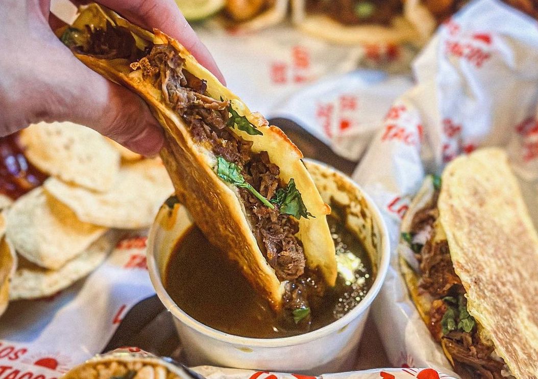 birria beef tacos dipped into in-house special birria sauce