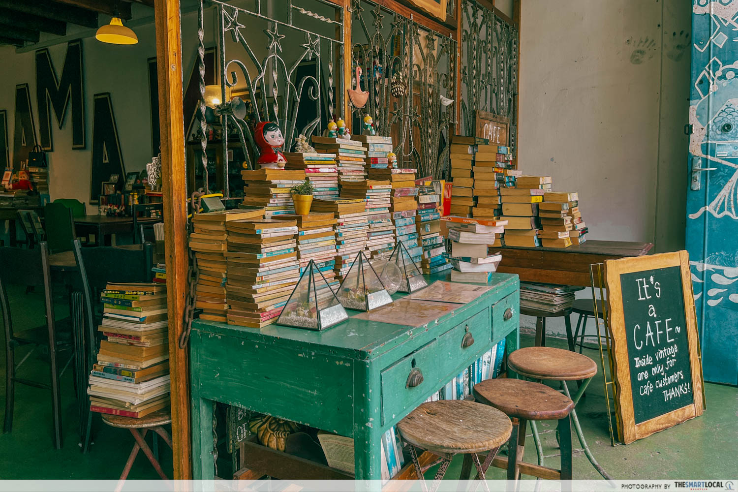 Pile of books at the daughter's cafe