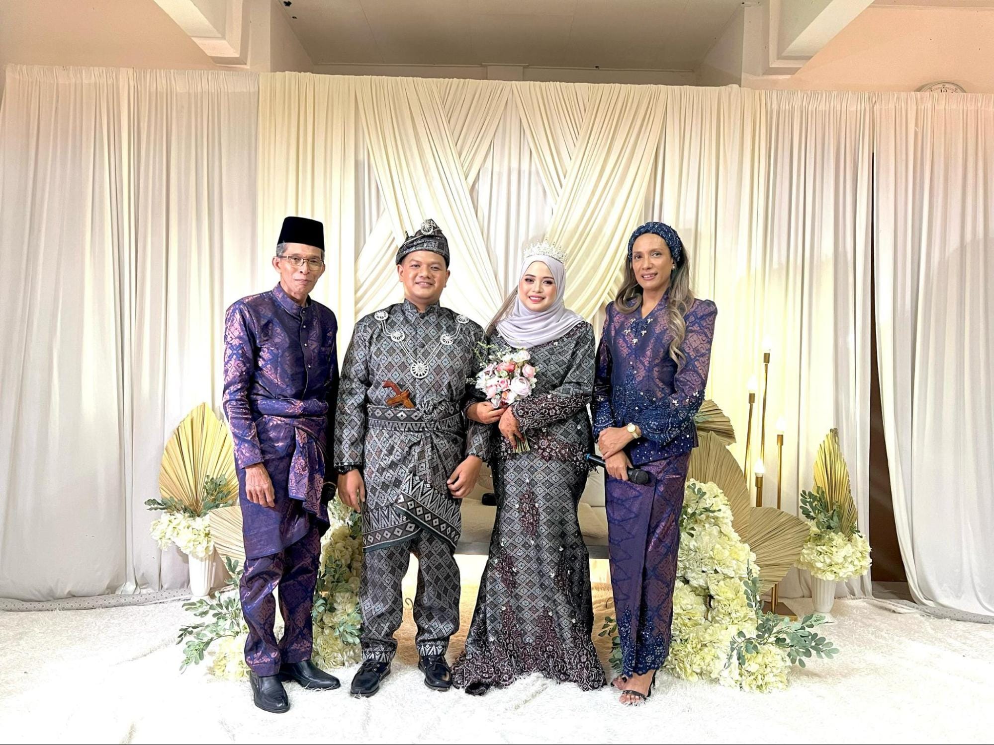 Pak Andam with wedding couple